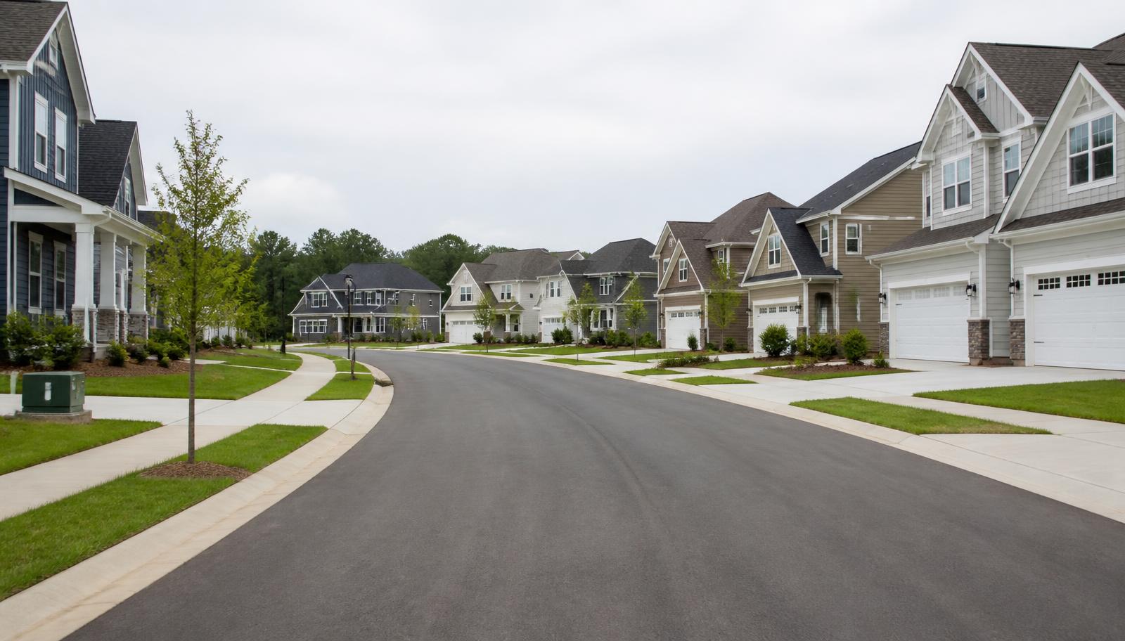 New subdivision street with finished concrete curbs